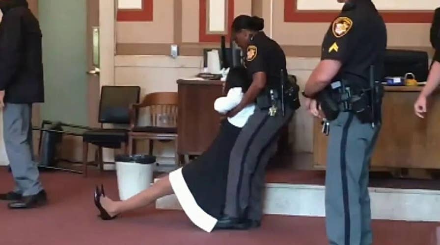 Raw video: Former judge is dragged out of the courtroom after being sentenced to jail