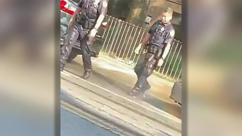 Gang member arrested for dumping water on NYPD officer, police say