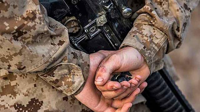 16 Marines arrested for alleged involvement in various illegal activities including human smuggling