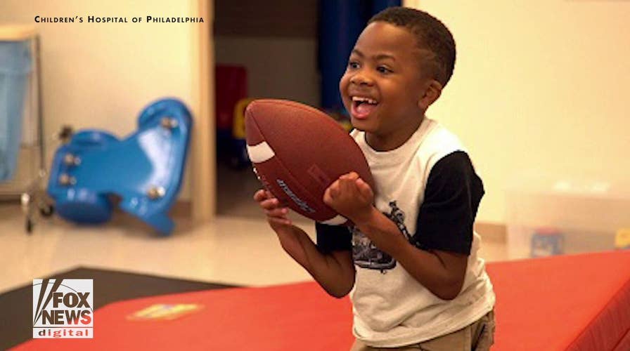 First child to undergo double hand transplant is excelling, doctors say