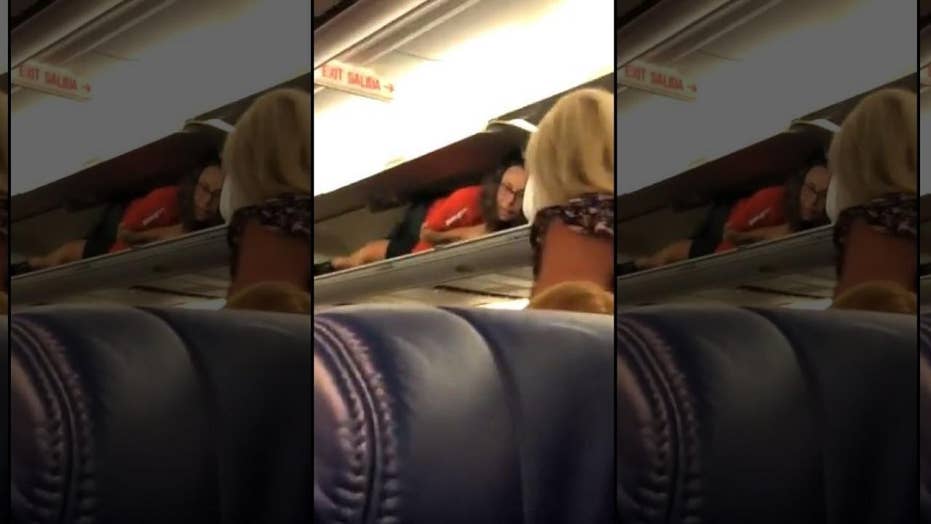 Southwest Airlines Flight Attendant Inside Overhead