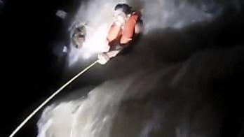 Iowa police pull couple from raging river in dramatic water rescue video: ‘Don’t let go’
