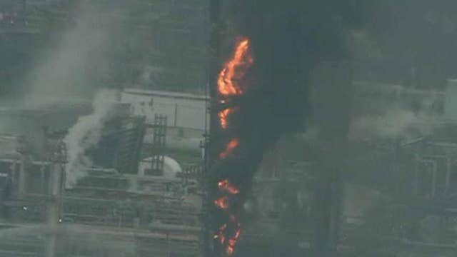 Crews battle fire burning at ExxonMobil oil refinery outside of Houston
