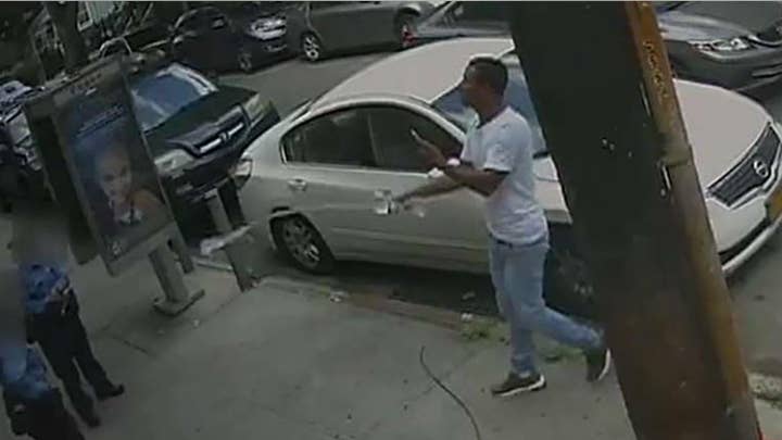 Man sprays water bottle on NYPD officers