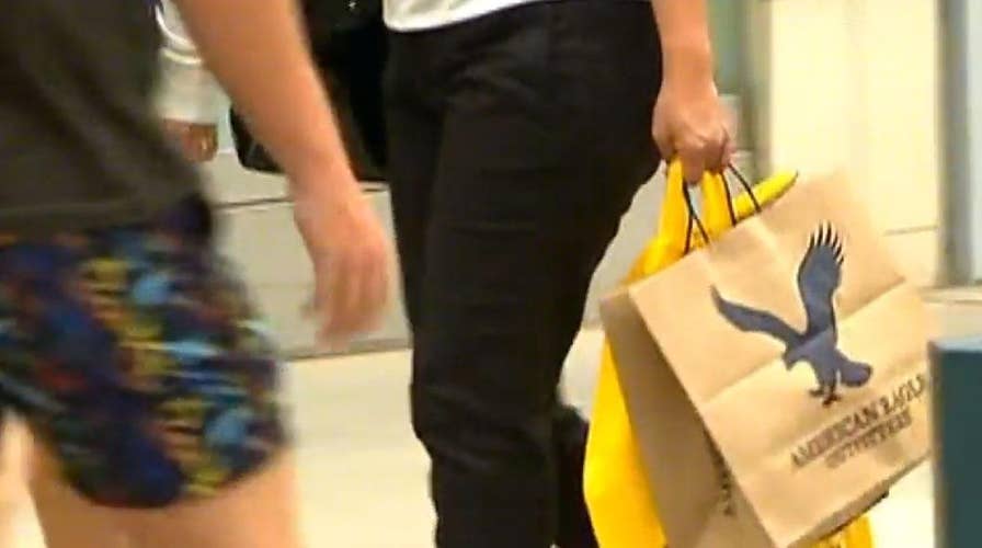 Americans spending more, earning more