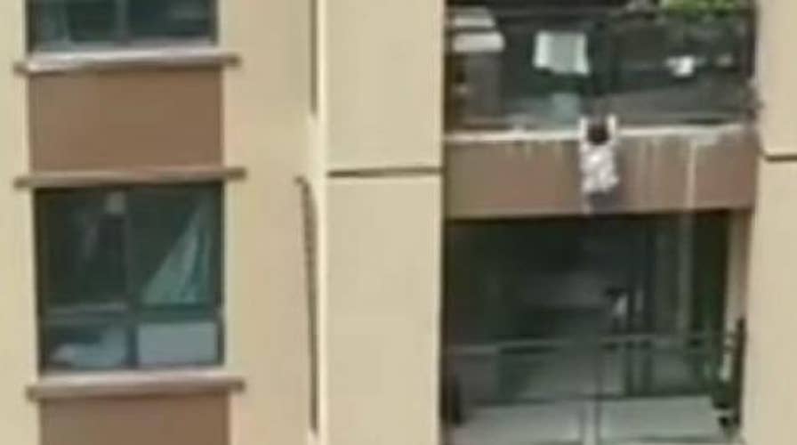 DISTURBING VIDEO: Child survives six-story fall, lands in blanket held by onlookers below