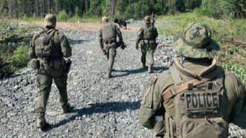 Canadian police to scale back manhunt for two teens suspected in killings of American woman, two others