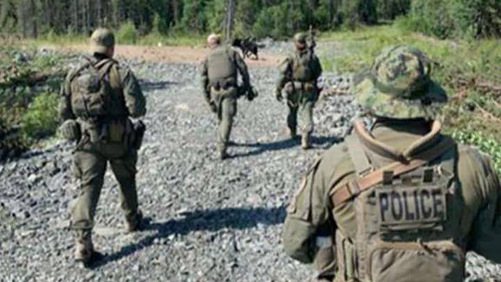 Canadian police to scale back manhunt for two teens suspected in killings of American woman, two others