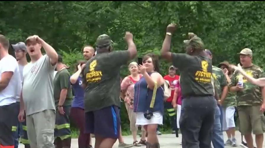 Laid off Kentucky miners block train, demand back pay