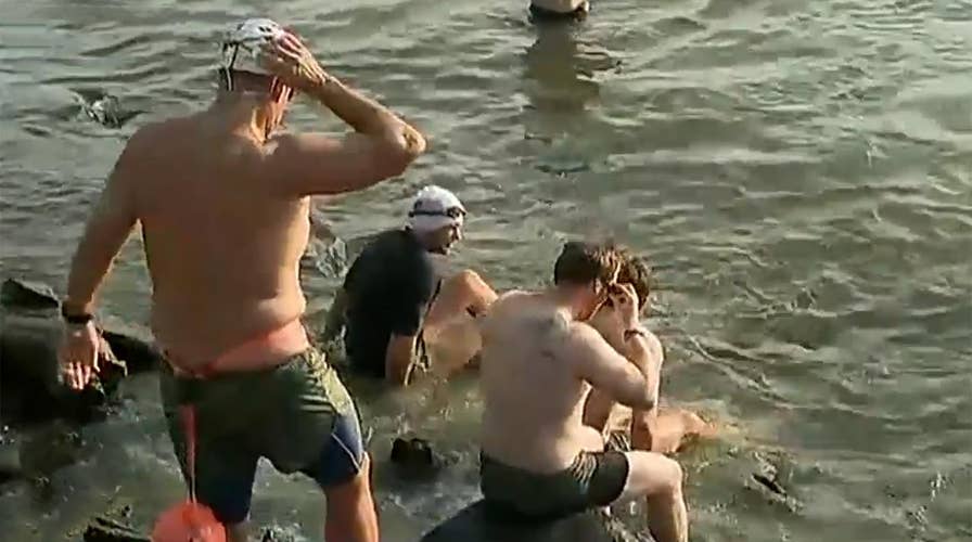 Pete Hegseth dives into the Hudson River along with over 30 Navy SEALs to honor our veterans