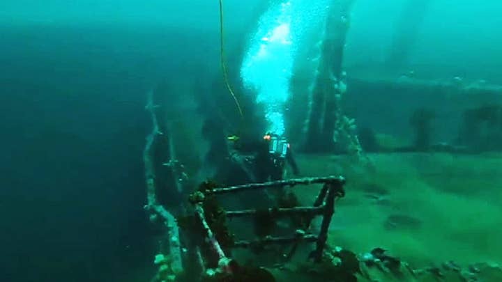 Canadian Navy divers retrieve shells and ammunition from wrecked merchant ships