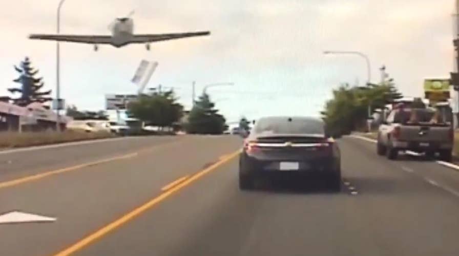 Small plane forced to make emergency landing on busy road