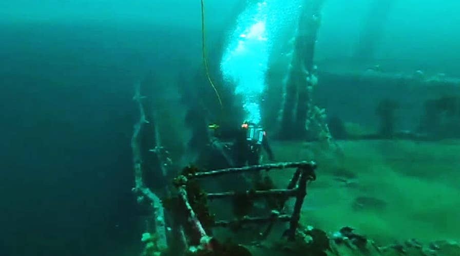 Canadian Navy divers retrieve shells and ammunition from wrecked merchant ships