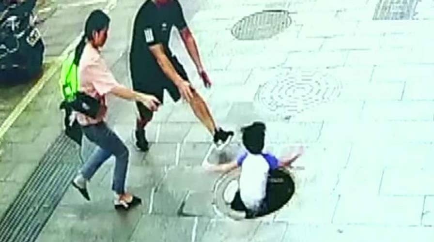 3-year-old falls through manhole in China, dad pulls him out