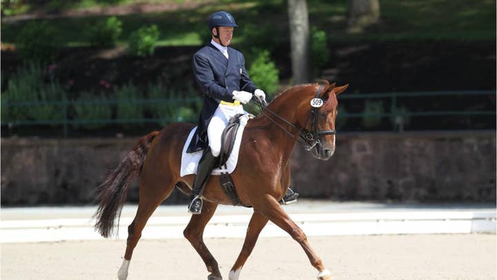A member of the 2008 Olympic dressage team is suspected of being the gunman after a woman is shot