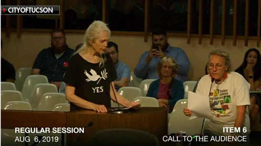 Two residents make a plea through song during town hall