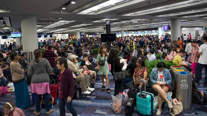 Hong Kong airport shut down after thousands of protesters swarm terminal