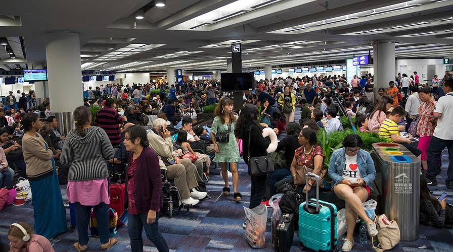 Hong Kong airport shut down after thousands of protesters swarm terminal