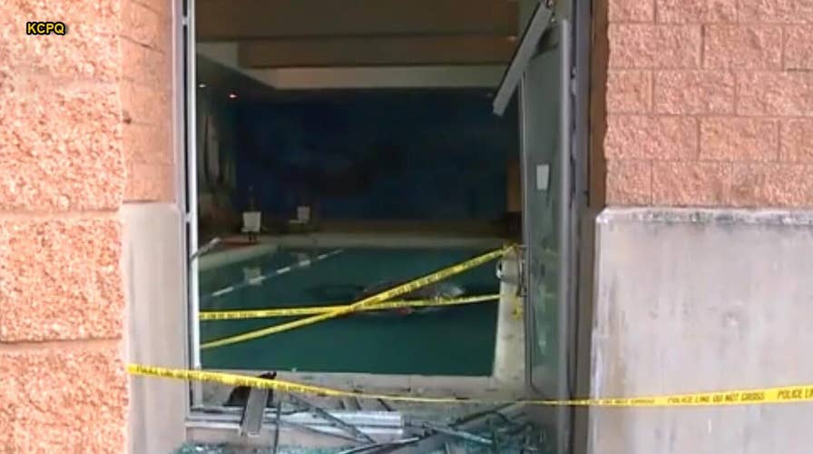 Man crashes car through LA Fitness building, drives straight into pool