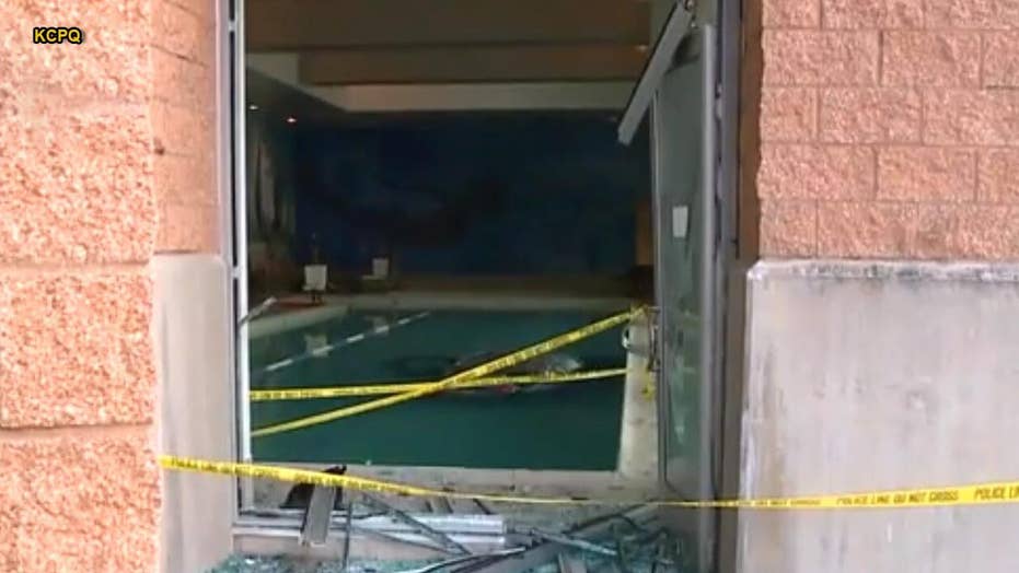 Man crashes car through LA Fitness building, drives straight into pool
