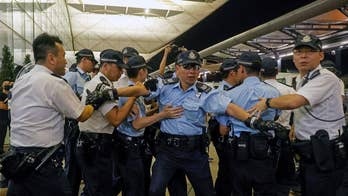 Riot police clash with protesters at Hong Kong airport