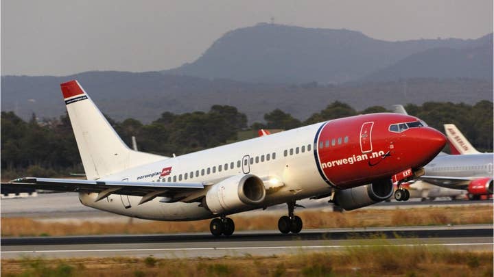 Shards from Norwegian Air flight fall 'like bullets' on neighborhood in Italy, damaging cars, rooftops