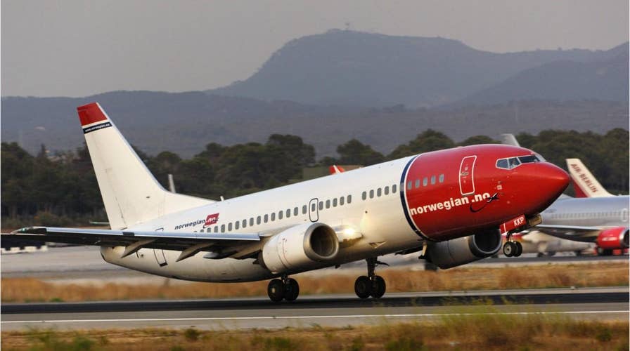Shards from Norwegian Air flight fall 'like bullets' on neighborhood in Italy, damaging cars, rooftops