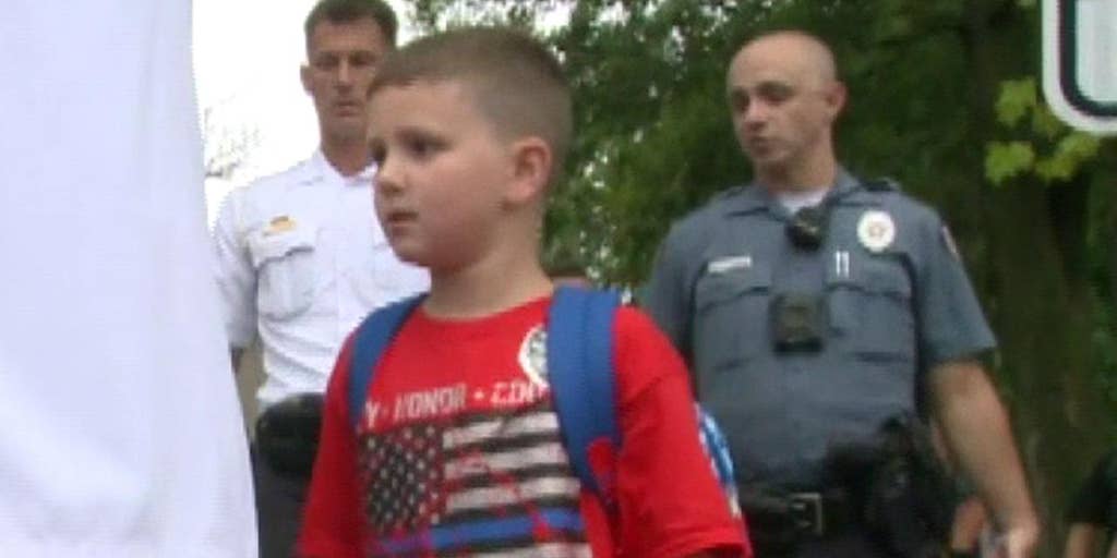 Missouri police officer battling cancer leaves hospital to walk autistic son to first day of kindergarten