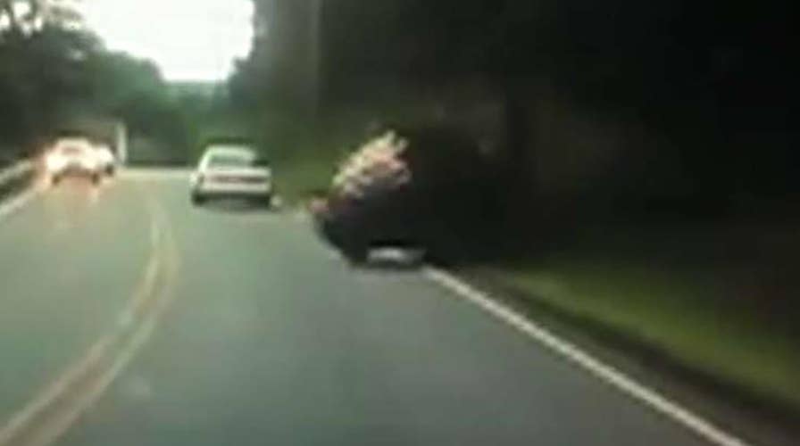 Texting driver hits pole, flips over in Massachusetts