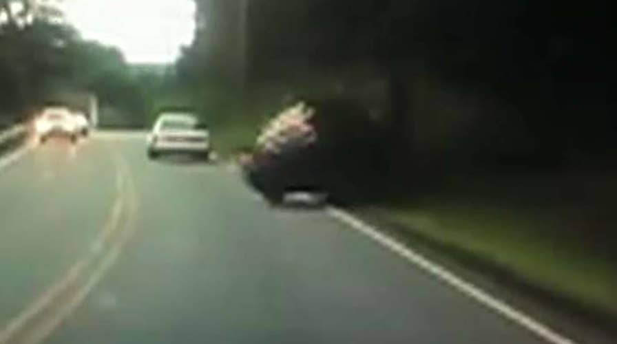 Texting driver hits pole, flips over in Massachusetts