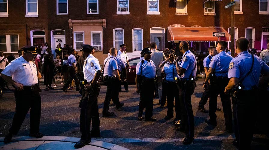 Philadelphia residents taunt police officers during standoff