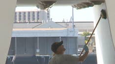 USS Arizona Memorial at Pearl Harbor on track for reopening, as Navy volunteers help to clean up iconic site