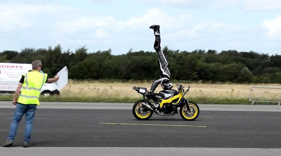 Motorcyclist sets headstand record at 76 mph