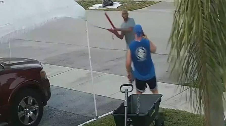 Raw video: Florida man pulls sword on another man during an argument over a trash pile
