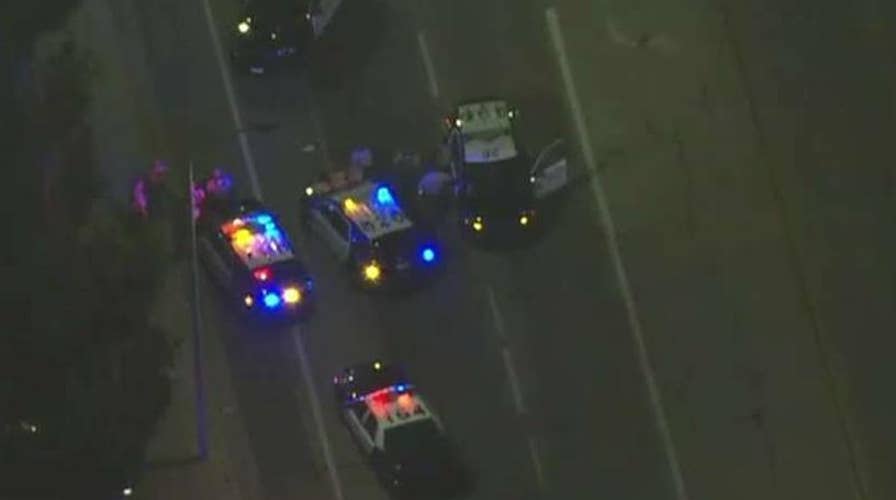 California deputy shot outside police station, sniper remains at large