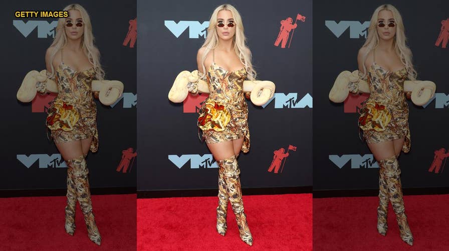 YouTube star Tana Mongeau stirs up controversy bringing live snake to VMA red carpet