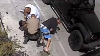 Good Samaritans help California cop subdue homeless suspect who tried to take deputy's weapon