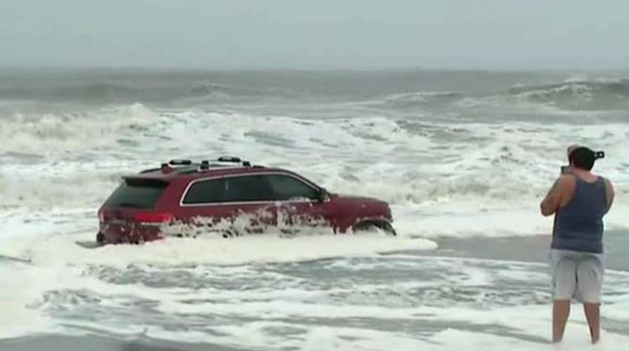 Hurricane Dorian's waves swamp SUV in Myrtle Beach, South Carolina