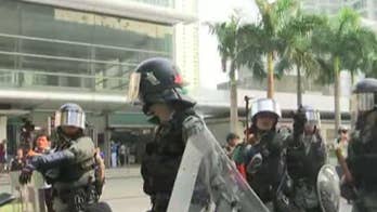 Hong Kong riot police take on protesters as street demonstrations continue