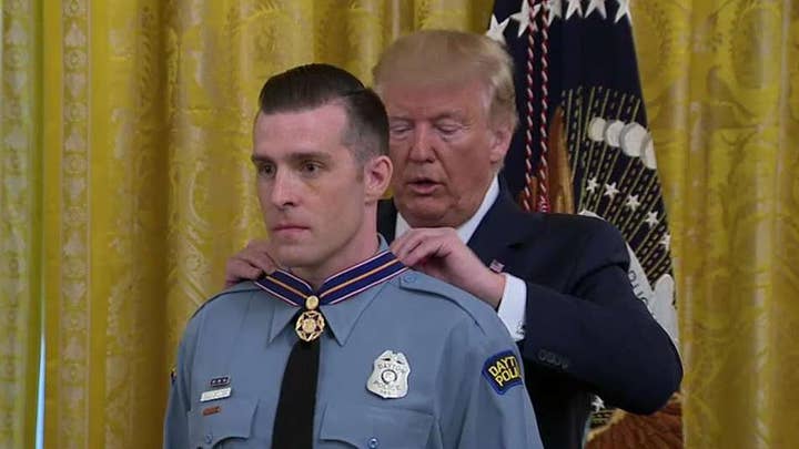 Officers and civilians honored at the White House for their response to mass shootings in Dayton and El Paso