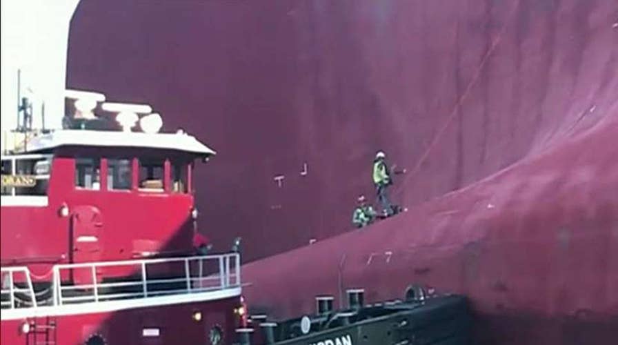 Coast Guard says three trapped crew members rescued from stricken cargo ship
