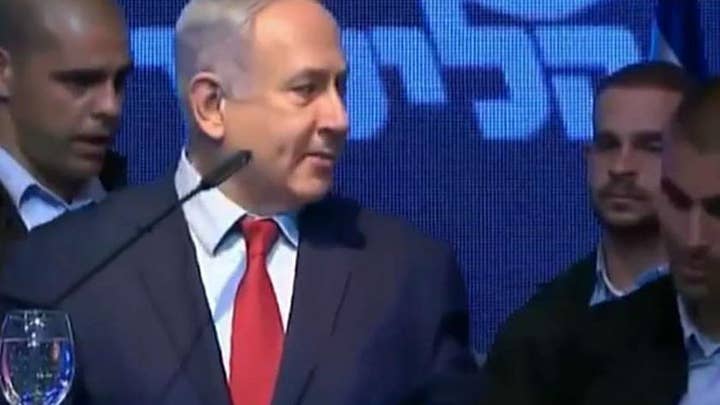 Israeli security forces rush Prime Minister Netanyahu from stage after rockets were fired into Israel