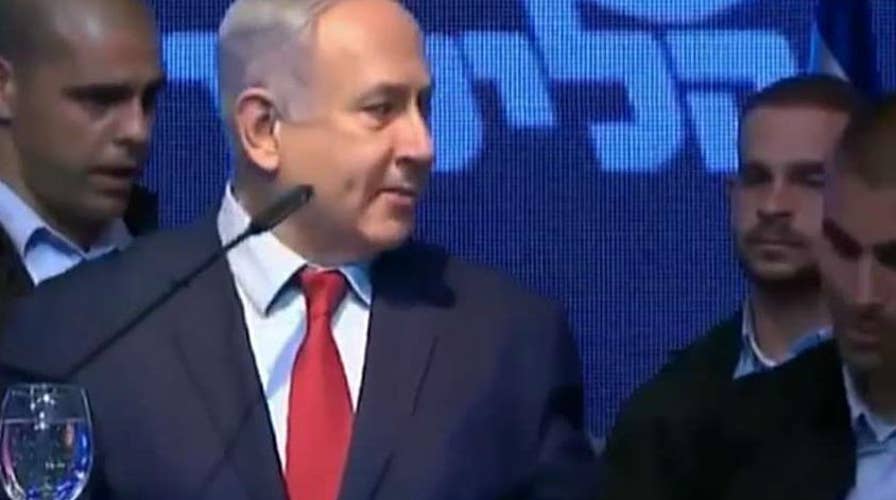 Israeli security forces rush Prime Minister Netanyahu from stage after rockets were fired into Israel