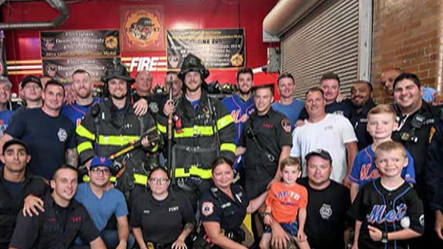 Members of NY Mets and NY Giants visit FDNY to commemorate 9/11