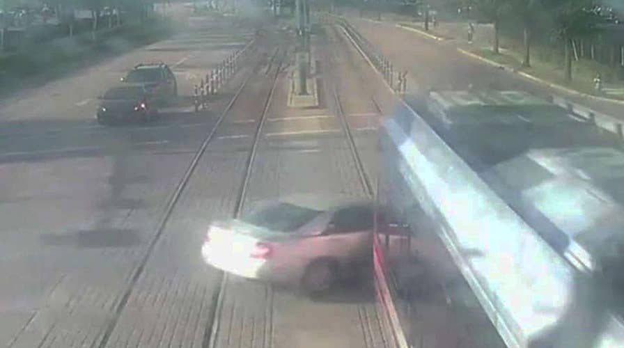 Surveillance cameras catch moment train smashes into car in Houston