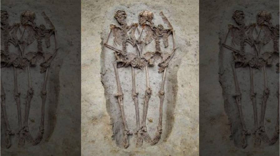 Experts: Mysterious ancient skeleton 'lovers' are both male