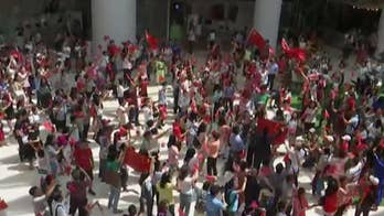 Dueling protests in Hong Kong as pro-Beijing demonstrators gather in shopping mall