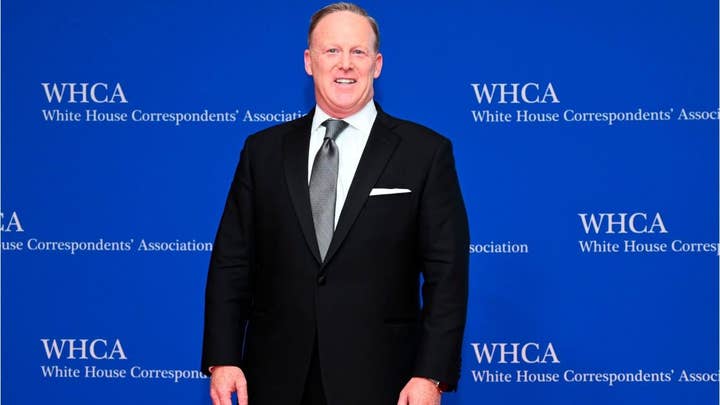 Sean Spicer appearance in Chicago draws protesters – including one who rushed the stage