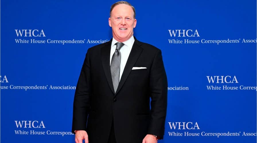 Sean Spicer appearance in Chicago draws protesters – including one who rushed the stage