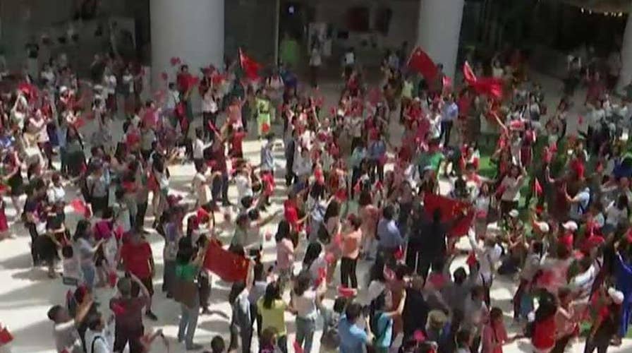 Dueling protests in Hong Kong as pro-Beijing demonstrators gather in shopping mall